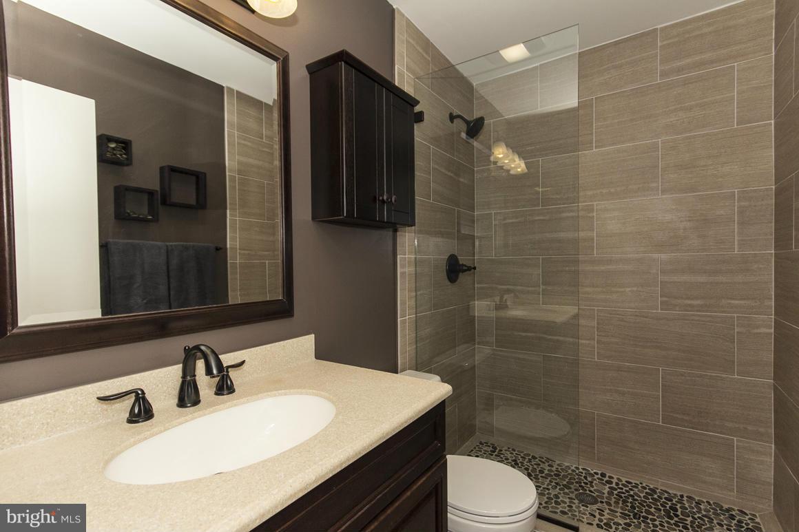 15 Robin Ridge Court Baltimore, MD 21234 - Photo 18 of 30 a bathroom with a sink toilet and shower