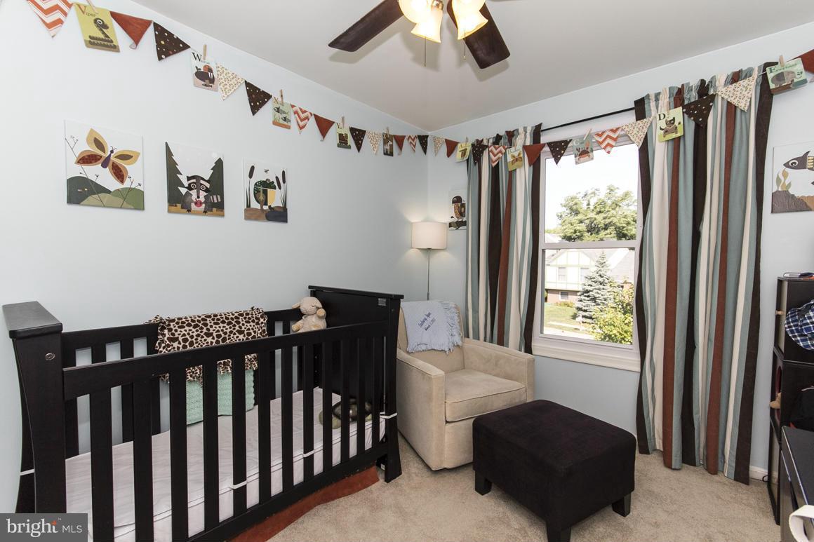 15 Robin Ridge Court Baltimore, MD 21234 - Photo 20 of 30 a bedroom with furniture and a window