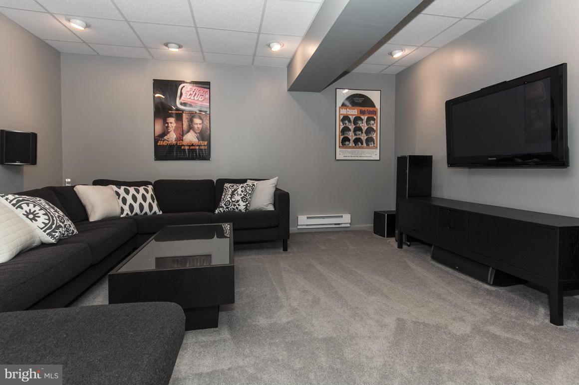 15 Robin Ridge Court Baltimore, MD 21234 - Photo 25 of 30 a living room with furniture and a flat screen tv