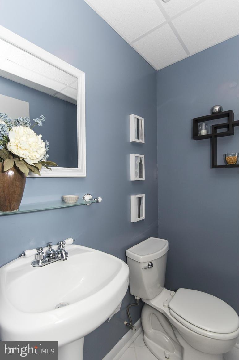 15 Robin Ridge Court Baltimore, MD 21234 - Photo 26 of 30 a bathroom with a sink a toilet and mirror