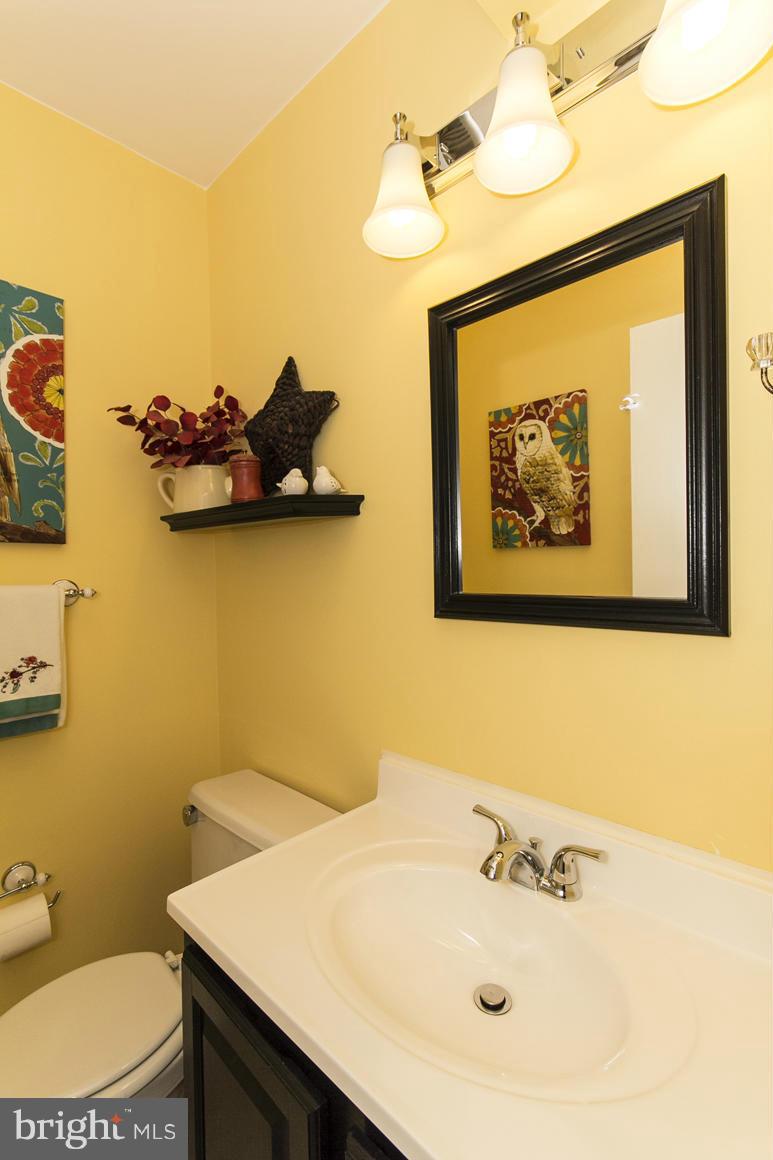 15 Robin Ridge Court Baltimore, MD 21234 - Photo 6 of 30 a bathroom with a sink mirror and toilet