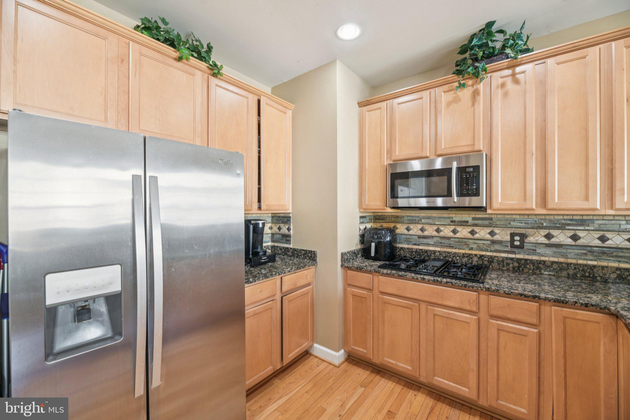 4334 Talmadge Circle Suitland, MD 20746 - Photo 12 of 29 a kitchen with stainless steel appliances a refrigerator sink and microwave
