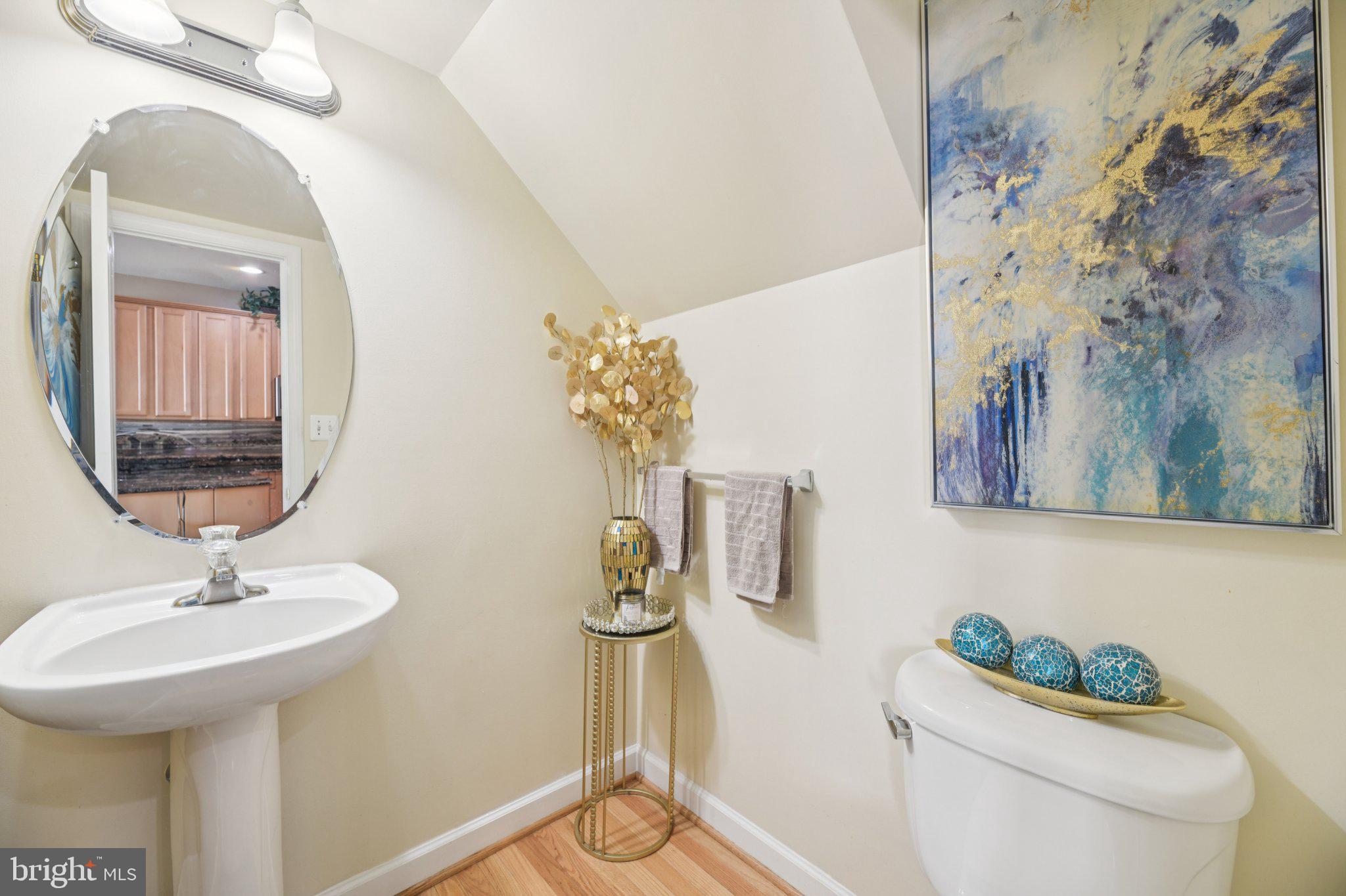 4334 Talmadge Circle Suitland, MD 20746 - Photo 14 of 29 a bathroom with a sink mirror and toilet