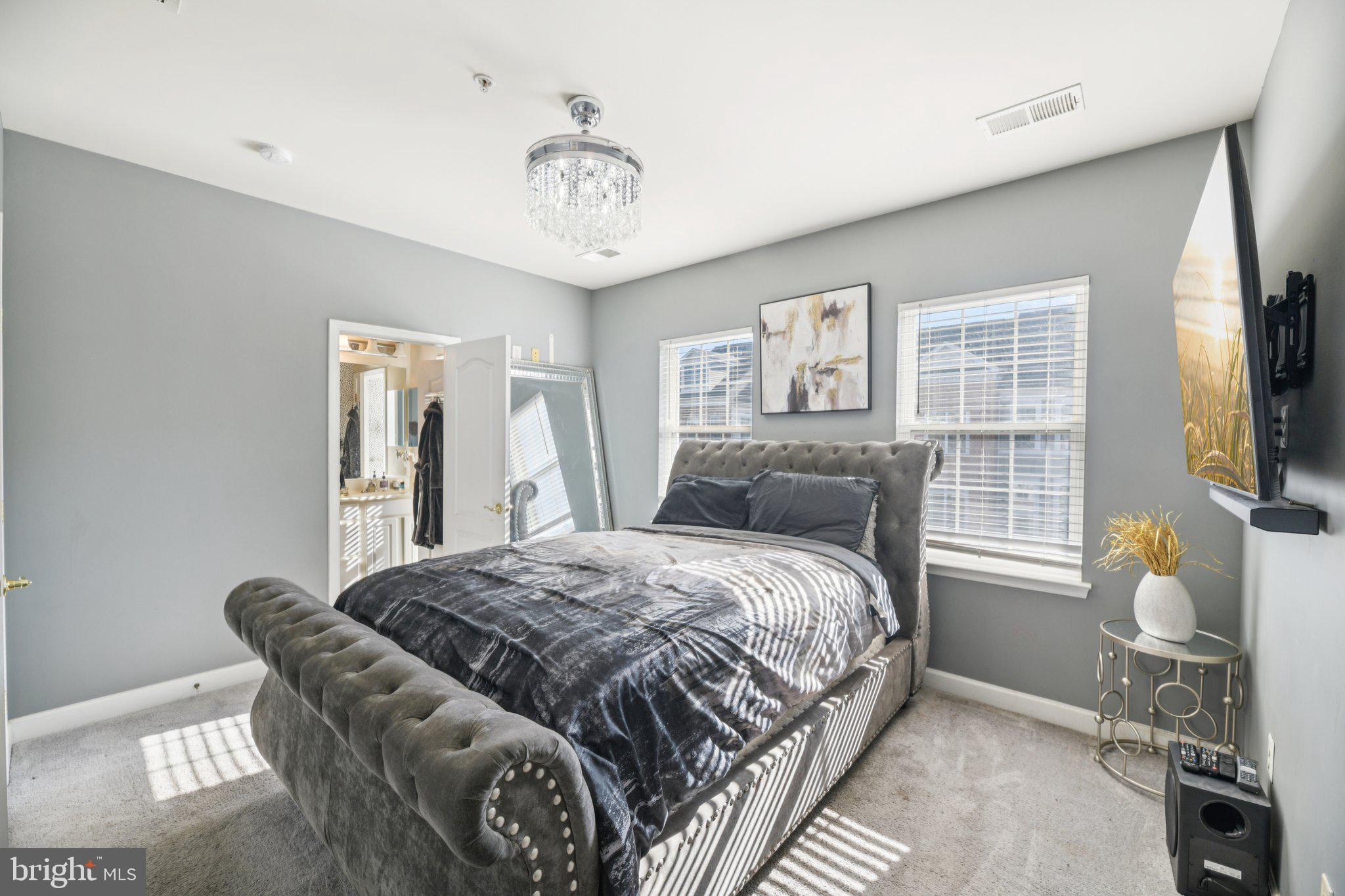 4334 Talmadge Circle Suitland, MD 20746 - Photo 17 of 29 a bedroom with a bed and a flat screen tv