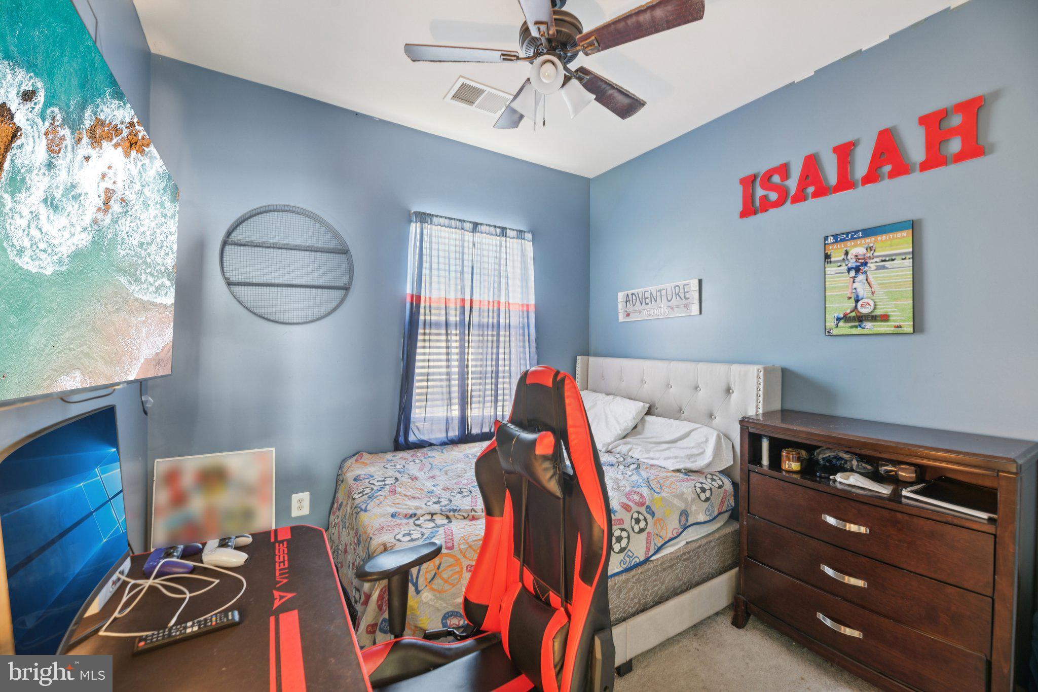 4334 Talmadge Circle Suitland, MD 20746 - Photo 20 of 29 a bedroom with a bed and a chandelier