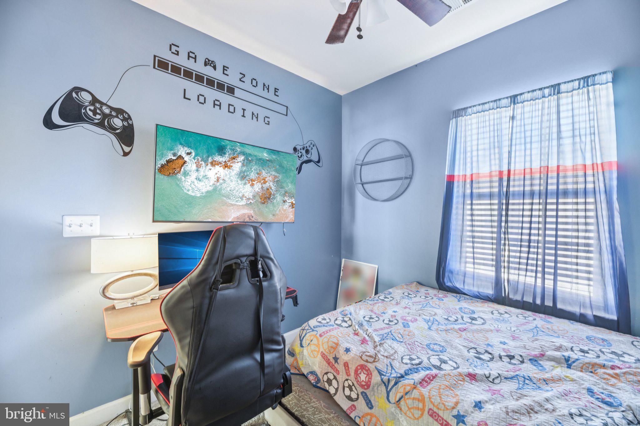 4334 Talmadge Circle Suitland, MD 20746 - Photo 21 of 29 a bedroom with a bed and a flat screen tv