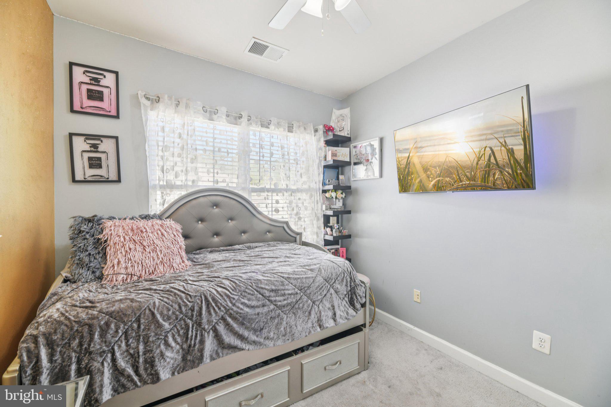 4334 Talmadge Circle Suitland, MD 20746 - Photo 24 of 29 a bedroom with a bed and a window