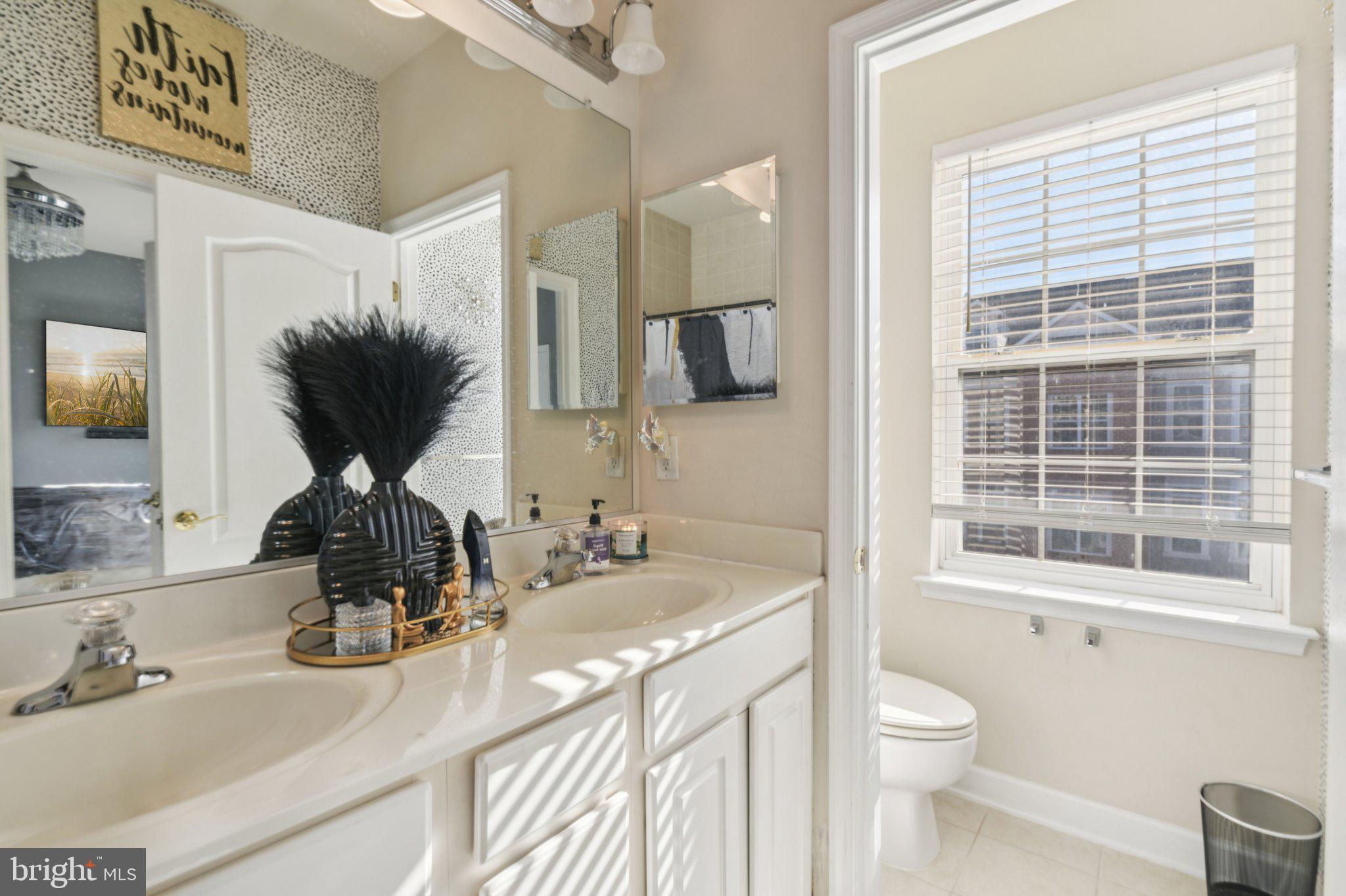 4334 Talmadge Circle Suitland, MD 20746 - Photo 27 of 29 a bathroom with a granite countertop sink and a large mirror
