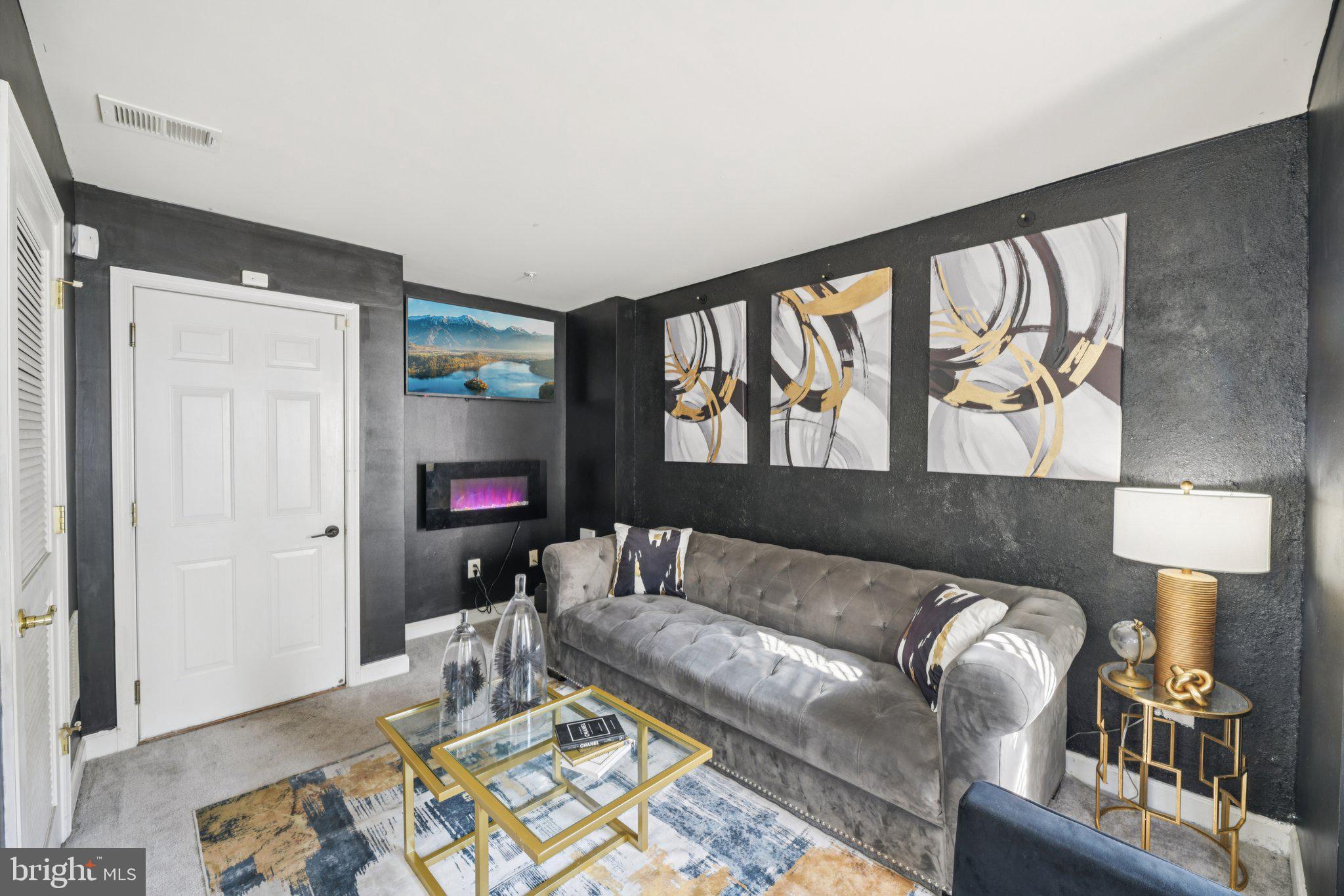 4334 Talmadge Circle Suitland, MD 20746 - Photo 3 of 29 a living room with a couch and a wooden floor