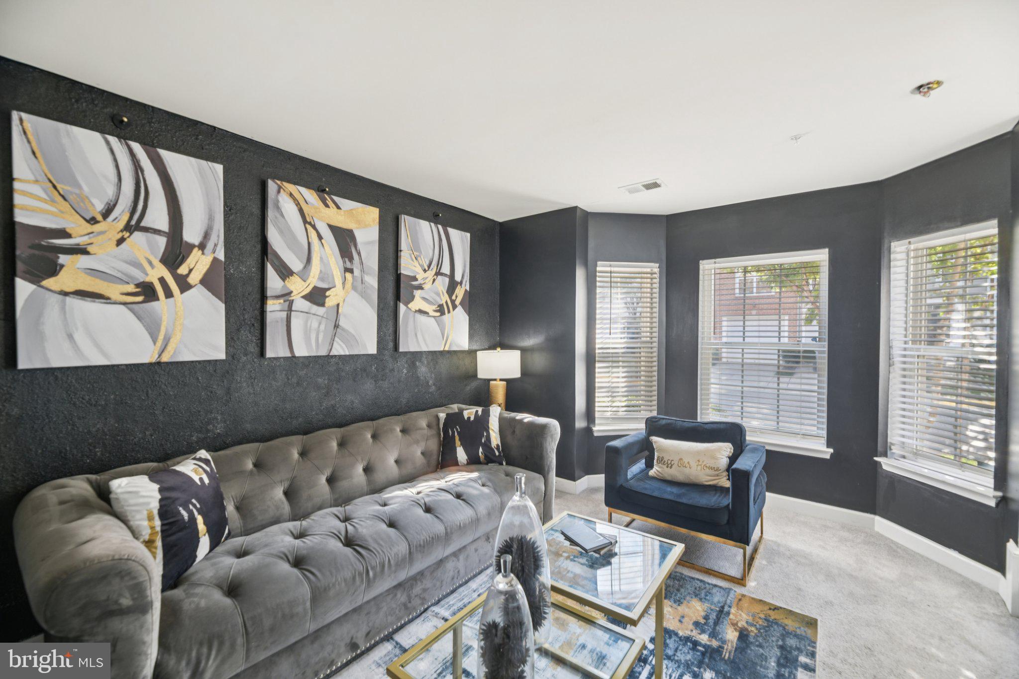 4334 Talmadge Circle Suitland, MD 20746 - Photo 4 of 29 a living room with furniture and large windows