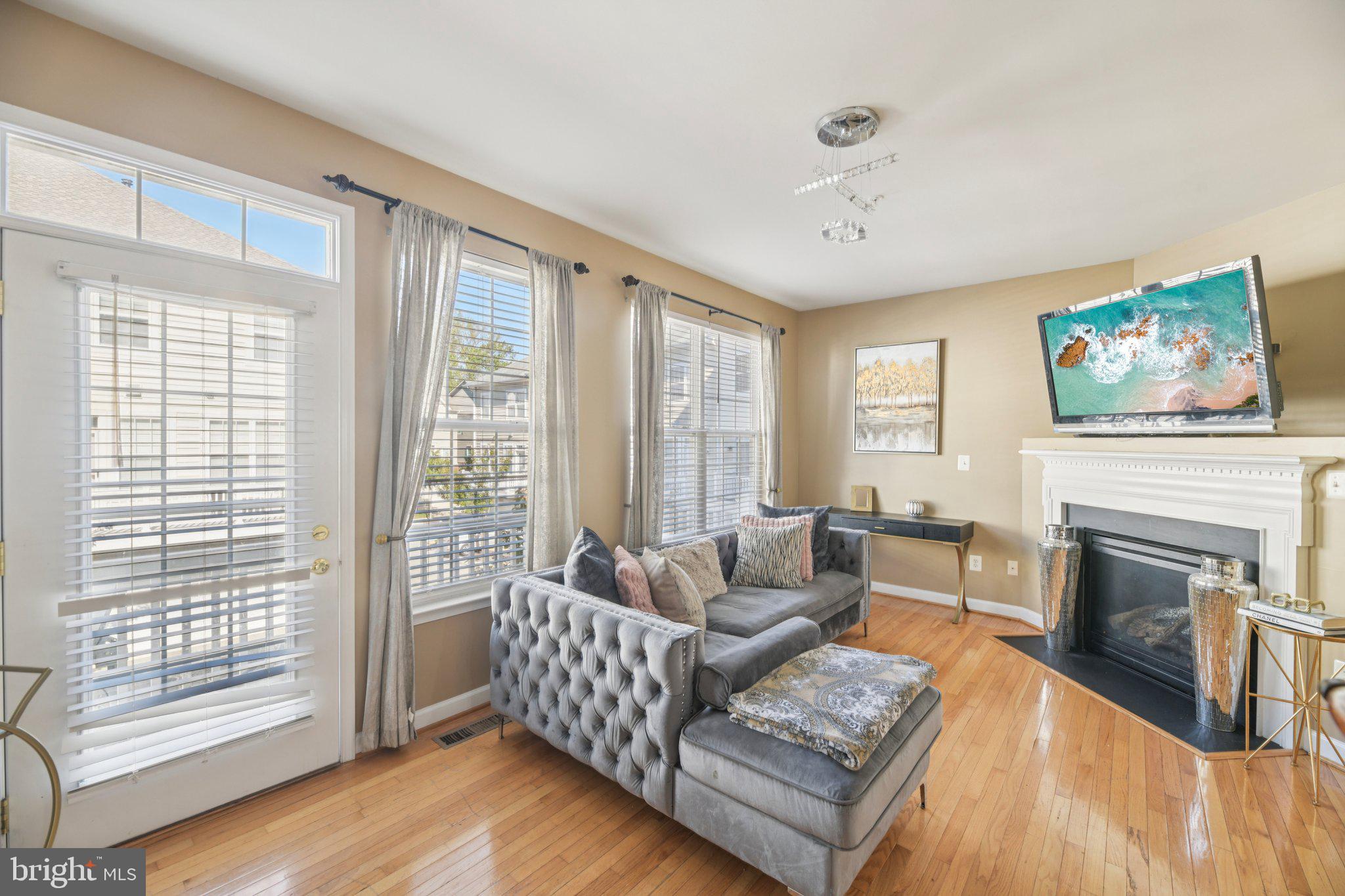 4334 Talmadge Circle Suitland, MD 20746 - Photo 5 of 29 a living room with furniture and a fireplace
