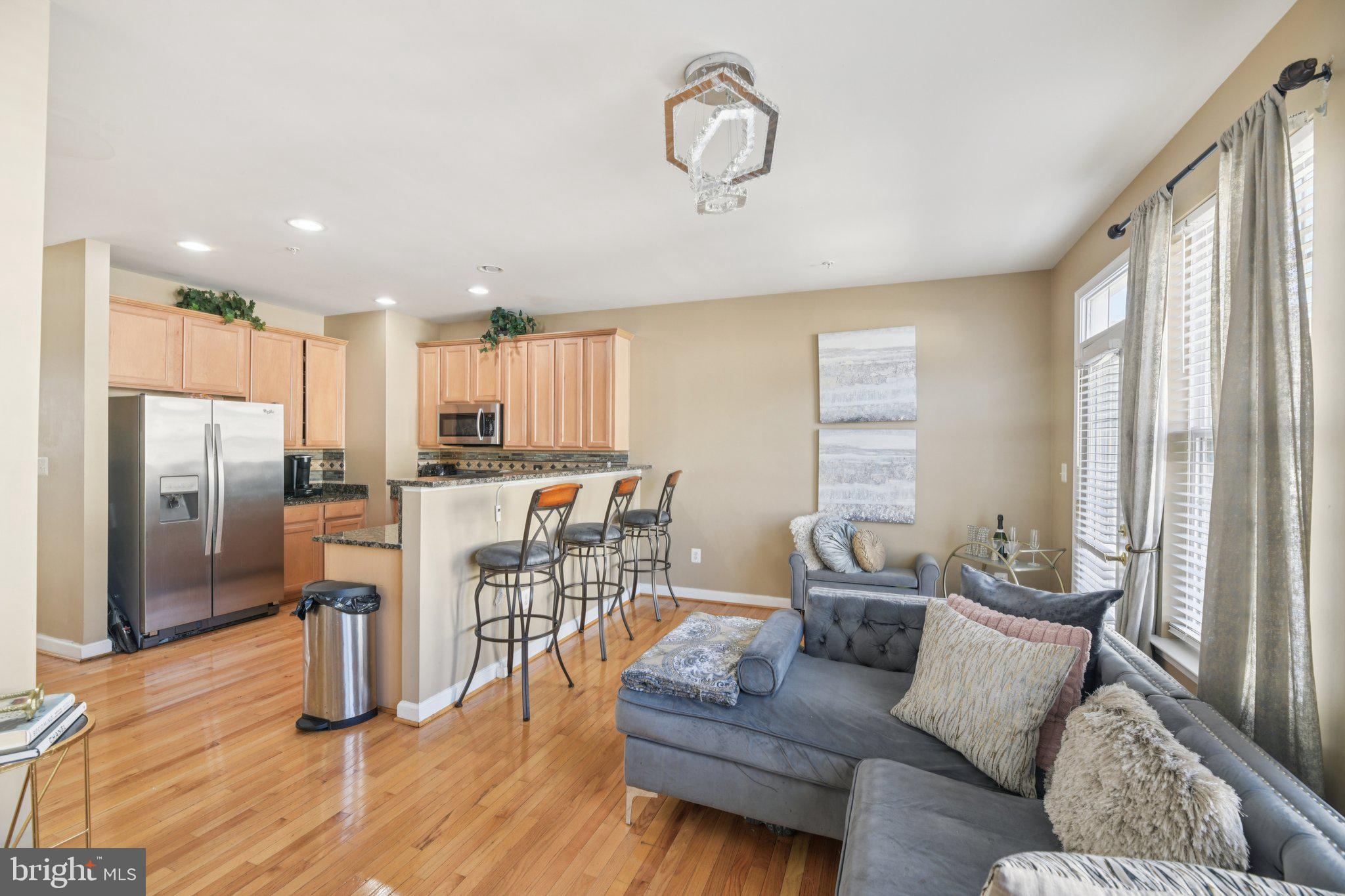 4334 Talmadge Circle Suitland, MD 20746 - Photo 7 of 29 a living room with furniture and kitchen view