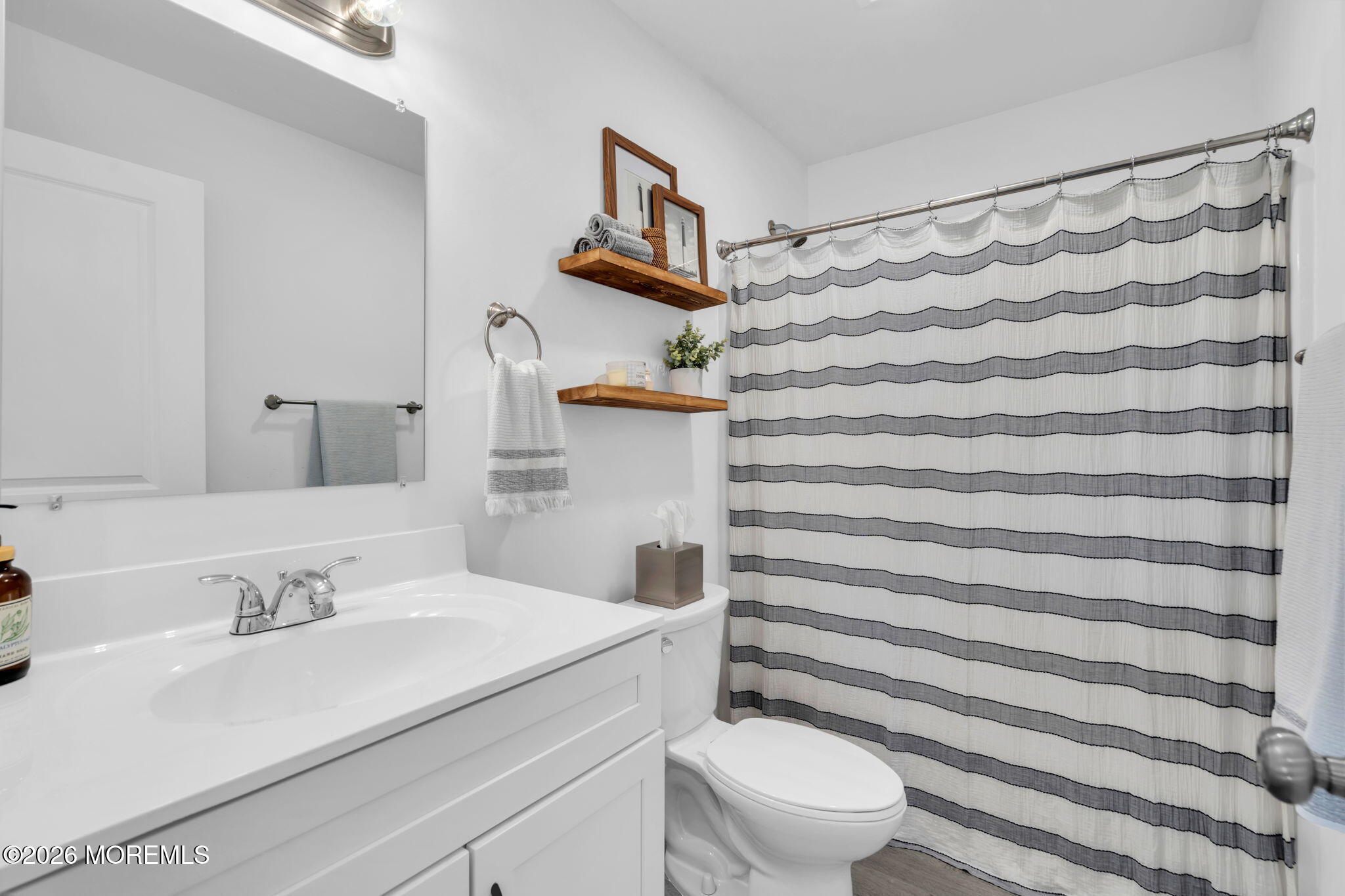 312 Beach Boulevard Forked River, NJ 08731 - Photo 29 of 40 a bathroom with a sink toilet and shower