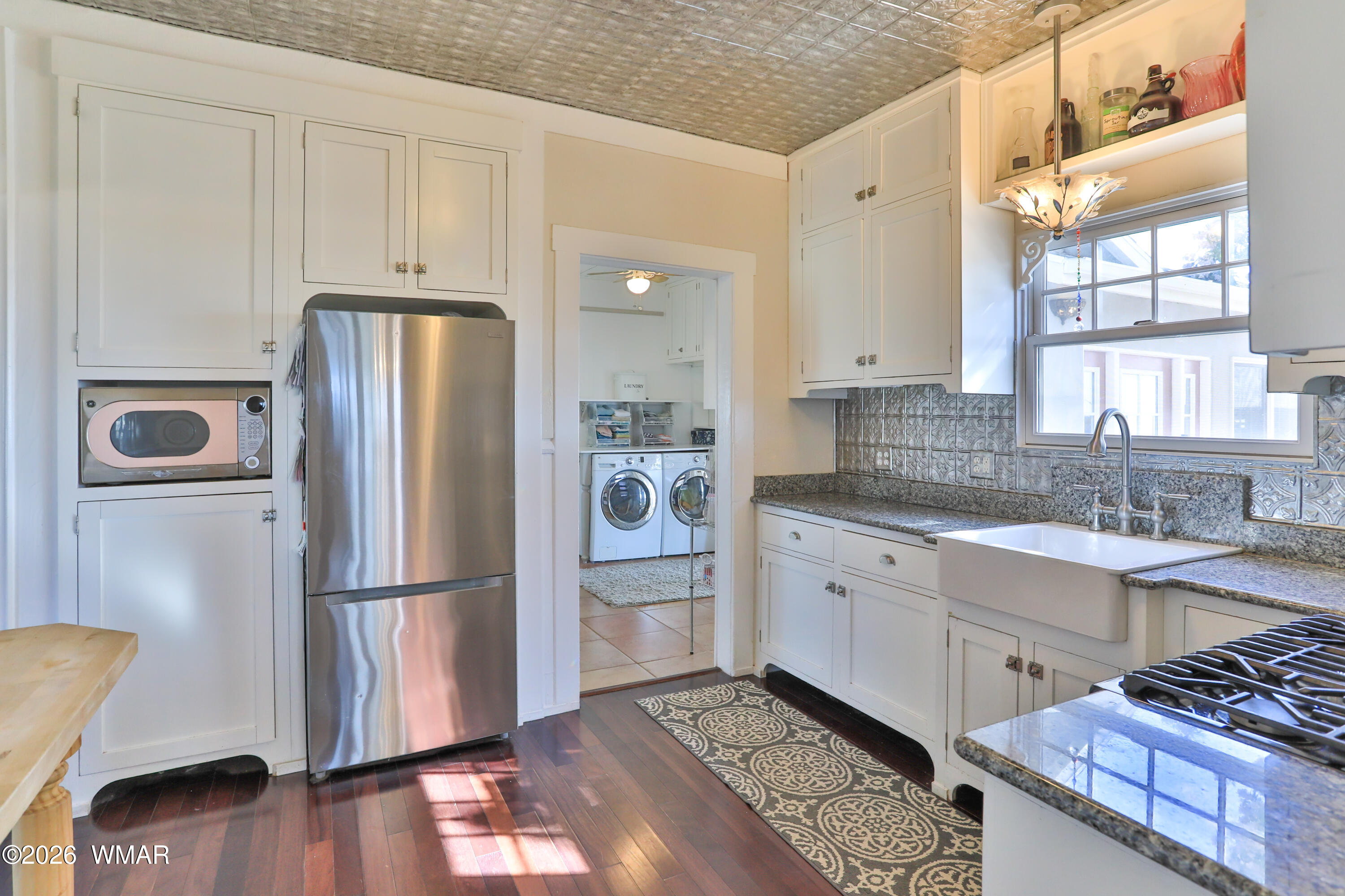 102 Crestview Road Holbrook, AZ 86025 - Photo 11 of 55 a kitchen with a refrigerator and a sink