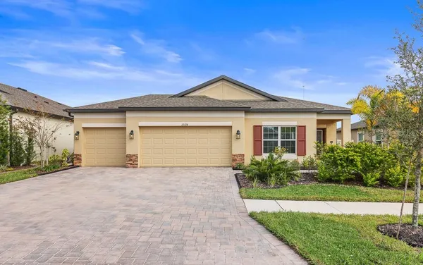 a front view of house with yard and green space