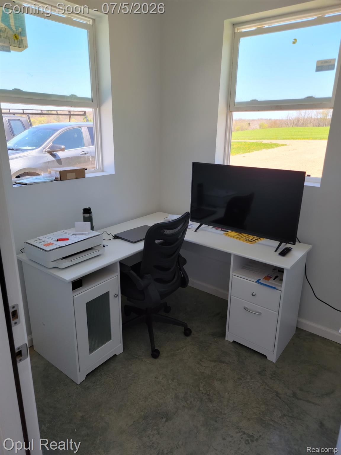 7503 Reading Road East Pittsford, MI 49271 - Photo 14 of 24 Dedicated office space featuring two windows, light-toned walls, and durable concrete flooring