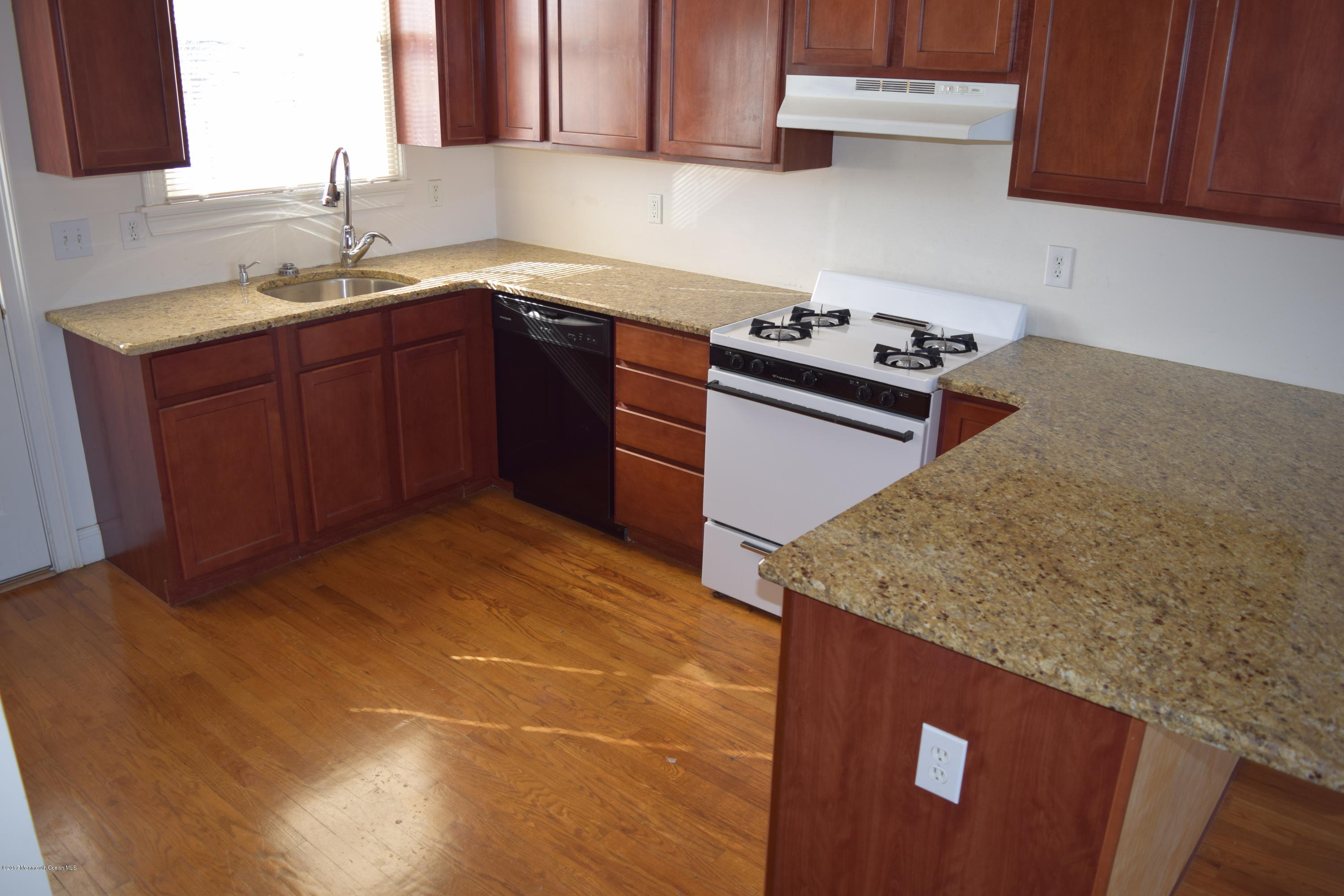 612 Front Street, Unit 7 Union Beach, NJ 07735 - Photo 3 of 15 a kitchen with a sink cabinets and appliances