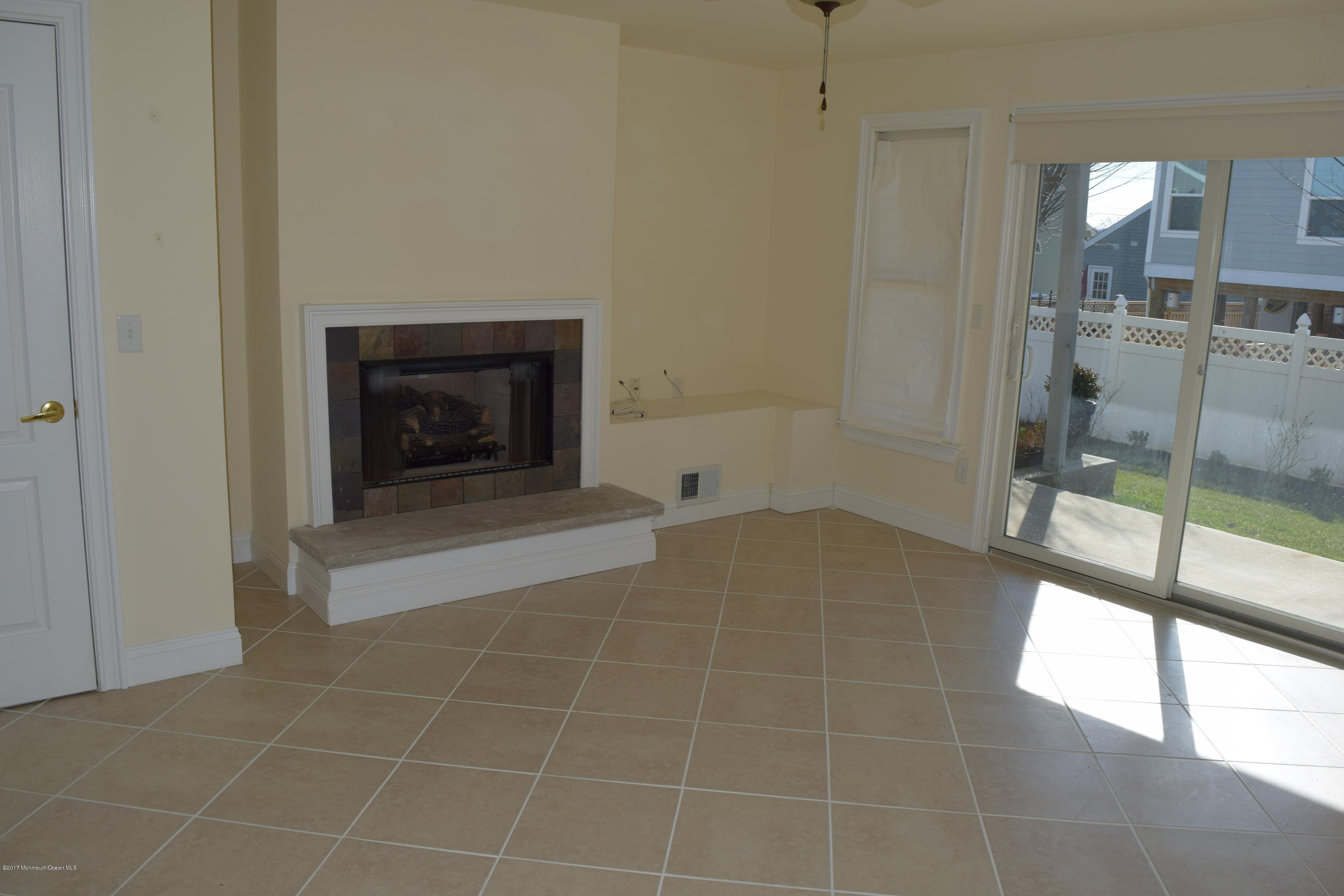 612 Front Street, Unit 7 Union Beach, NJ 07735 - Photo 8 of 15 a view of an empty room with glass door