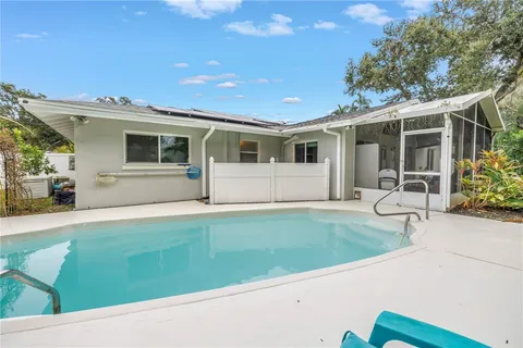a view of a swimming pool with a patio