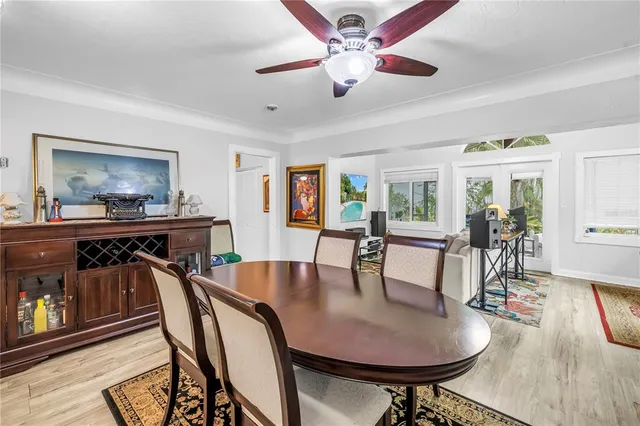 a living room with furniture and a painting on the wall