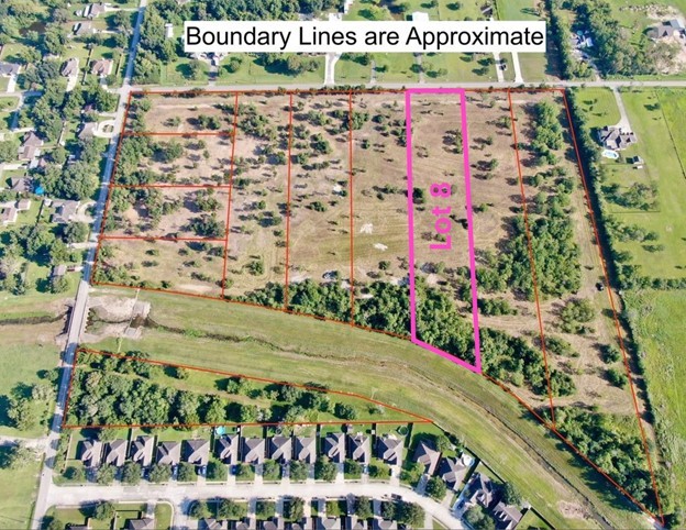 a sign that is sitting in front of flowers