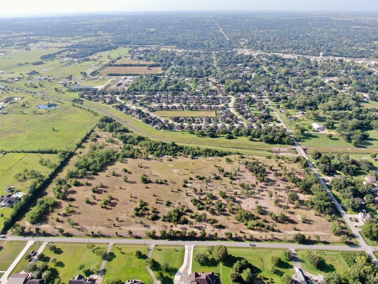 0 7th Street Santa Fe, TX 77510 - Photo 7 of 9 an aerial view of residential houses with outdoor space