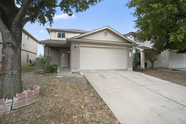 a view of a white house with a outdoor space