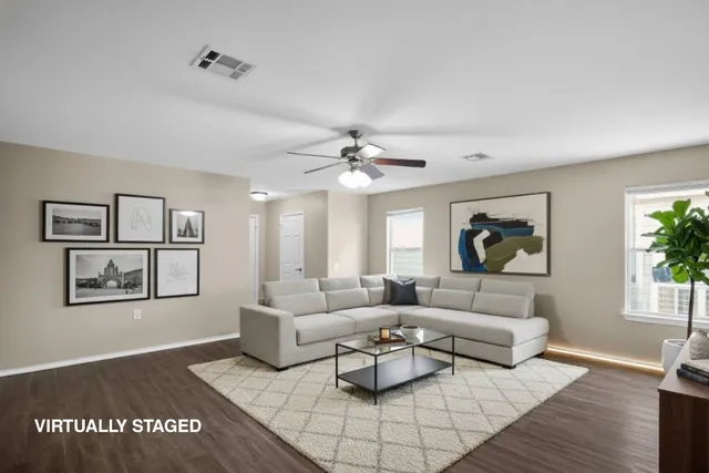 a living room with furniture and a window