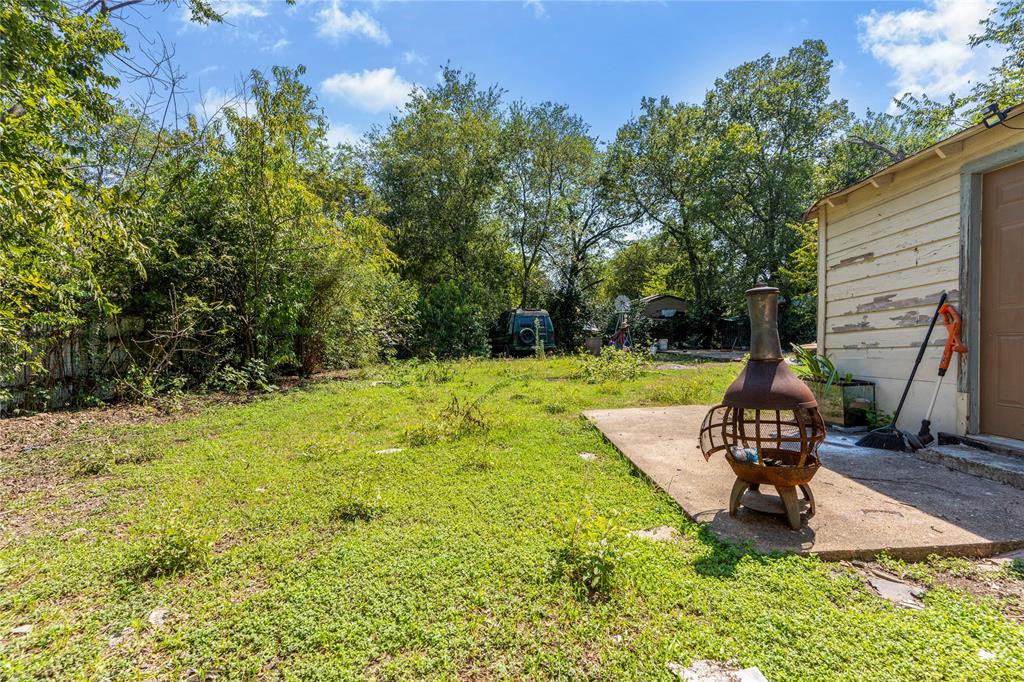 548 Elston Drive Dallas, TX 75232 - Photo 12 of 21 a swimming pool with some trees in the background