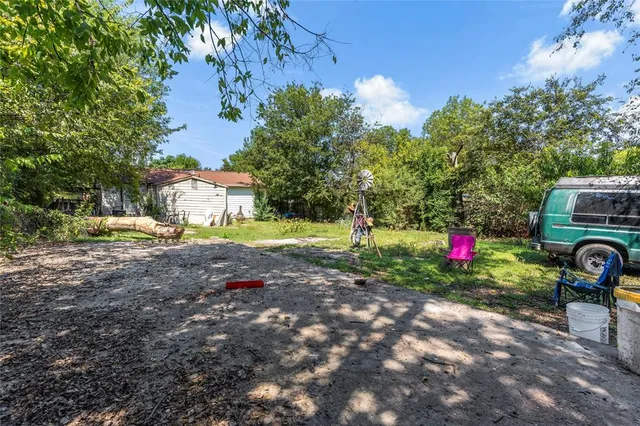 a view of a park with swings and slides
