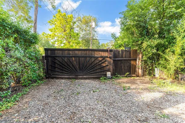 a wooden fence with trees