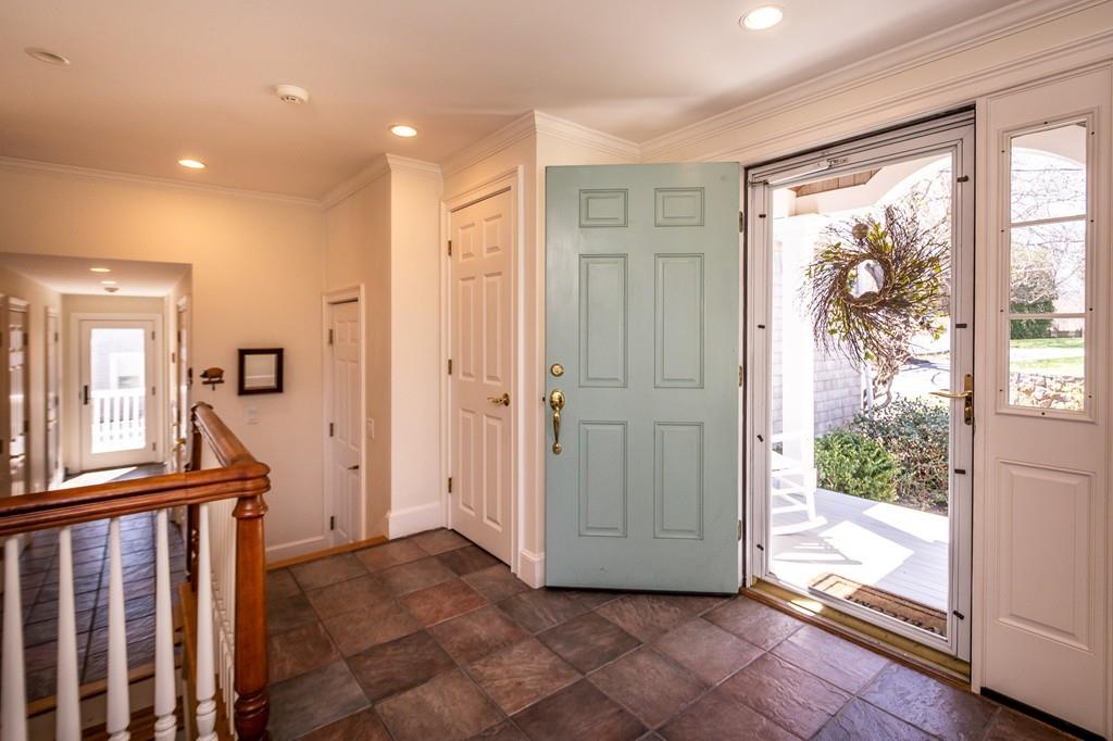 33 Stanton Road Cohasset, MA 02025 - Photo 11 of 40 a view of a hallway with wooden floor and entryway