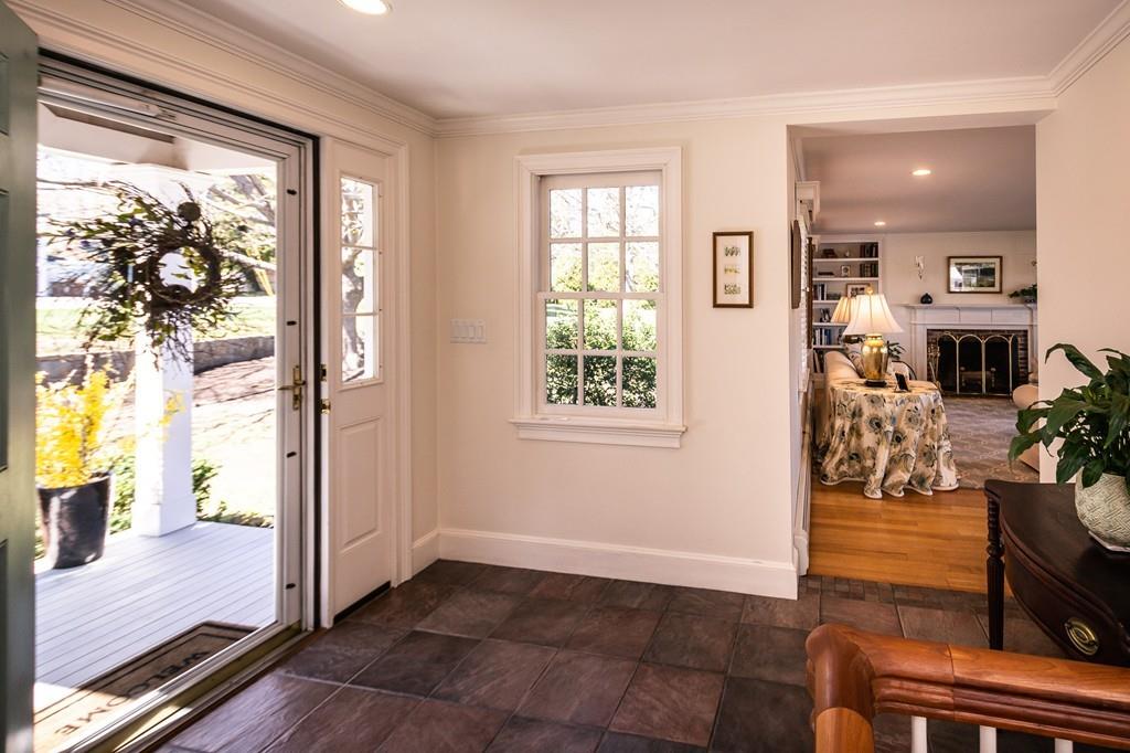 33 Stanton Road Cohasset, MA 02025 - Photo 12 of 40 a view of an entryway with wooden floor and a livingroom