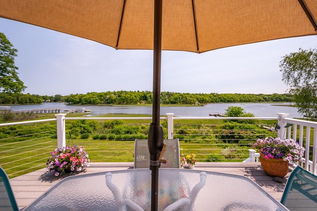 33 Stanton Road Cohasset, MA 02025 - Photo 2 of 40 a view of a ocean from a seating area
