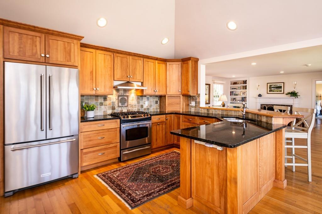 33 Stanton Road Cohasset, MA 02025 - Photo 21 of 40 a kitchen with stainless steel appliances granite countertop a sink stove and refrigerator