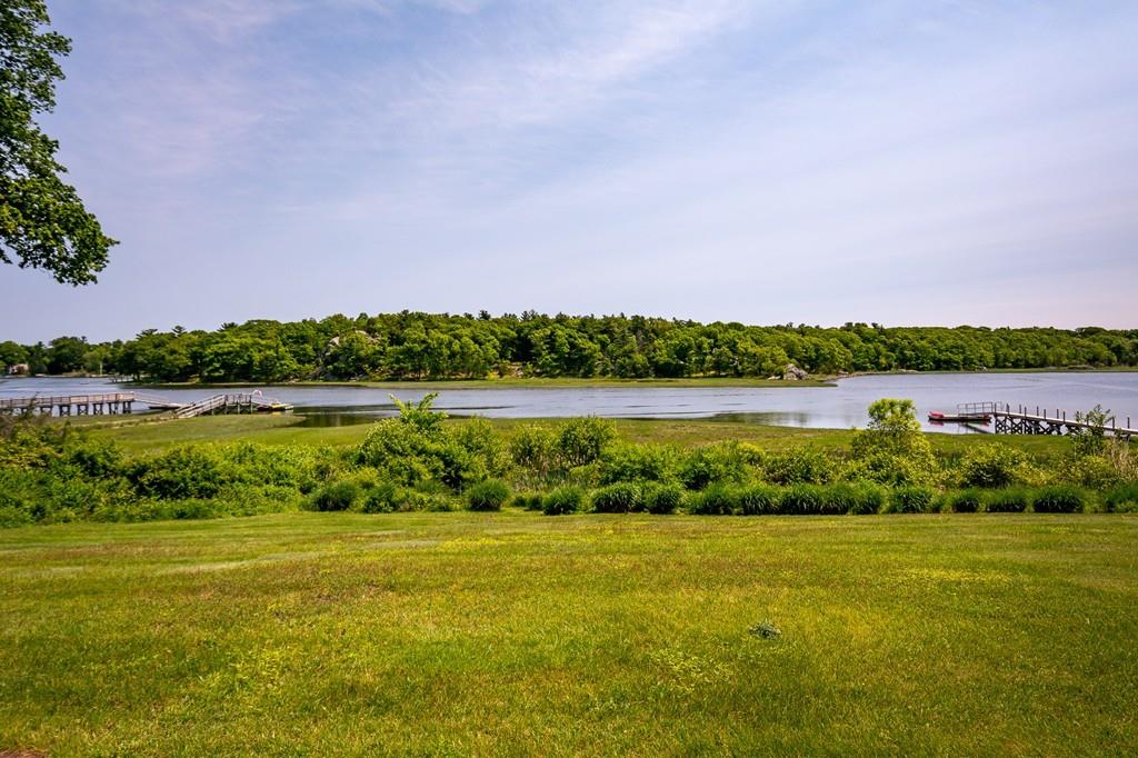 33 Stanton Road Cohasset, MA 02025 - Photo 28 of 40 a view of a lake with houses in the background