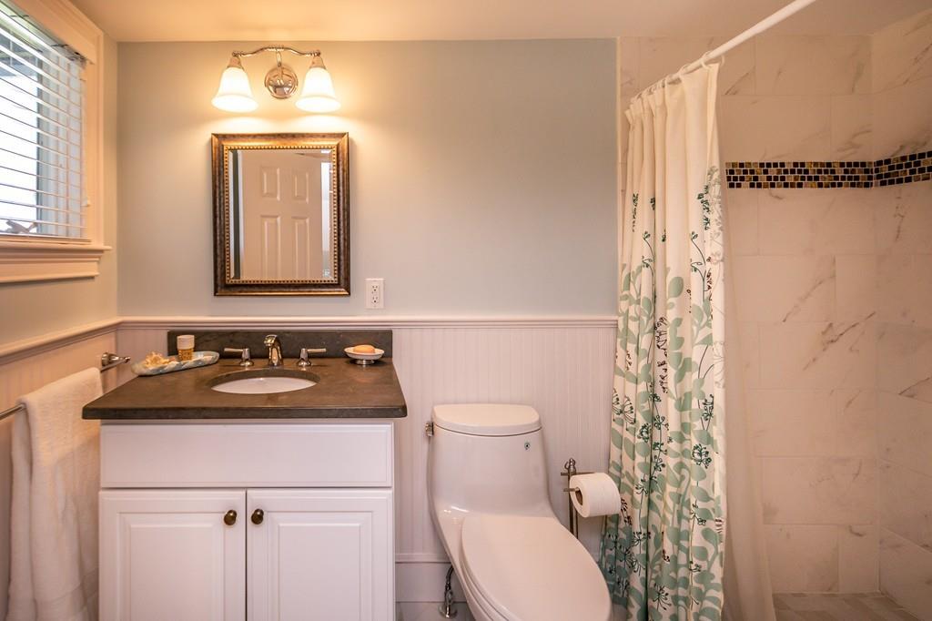 33 Stanton Road Cohasset, MA 02025 - Photo 33 of 40 a bathroom with a sink toilet and mirror