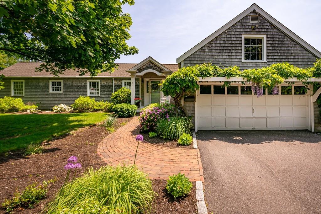 33 Stanton Road Cohasset, MA 02025 - Photo 9 of 40 a front view of a house with garden