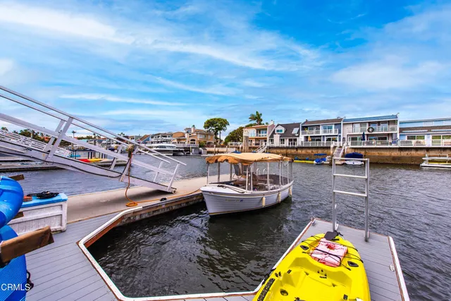 a view of a lake with a table and chairs