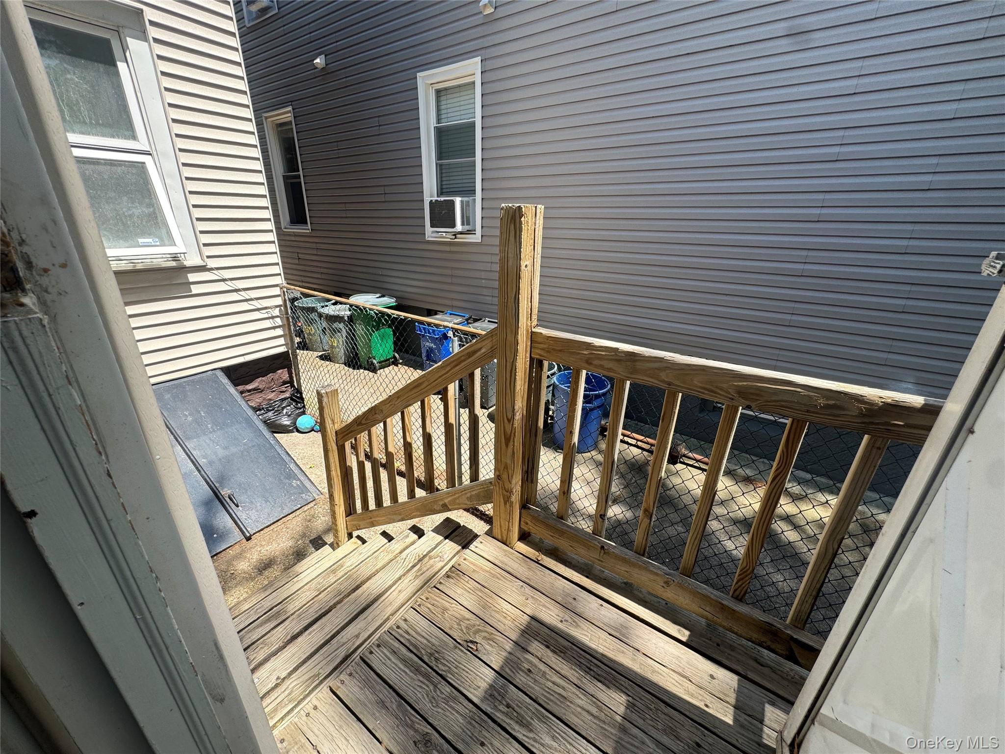 80-58 88th Road Queens, NY 11421 - Photo 19 of 21 a view of a balcony with wooden floor