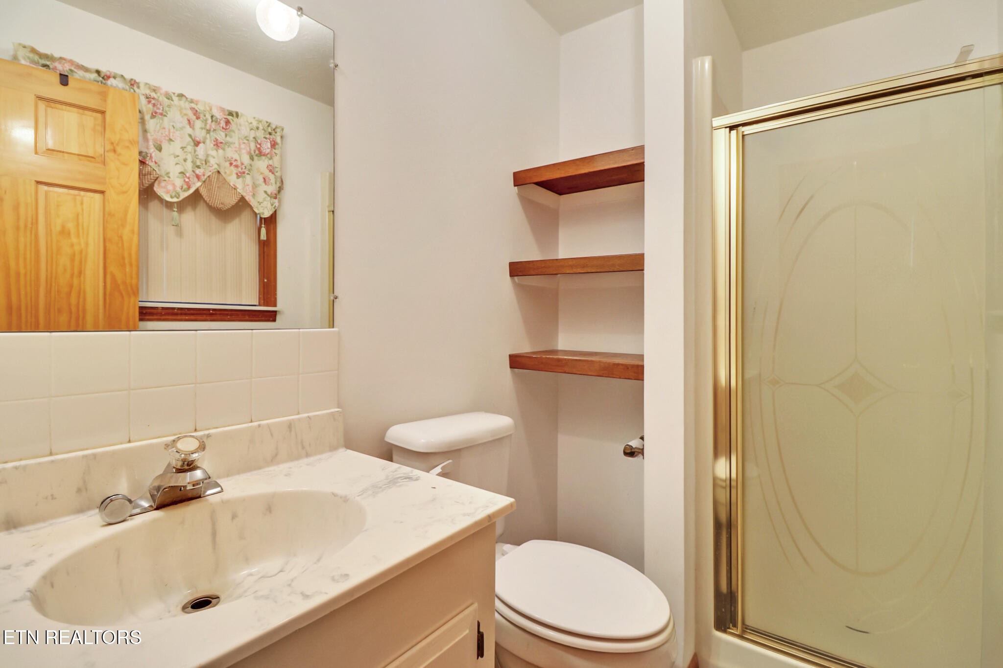 1190 Sand Cut Road Oneida, TN 37841 - Photo 22 of 41 a bathroom with a sink a toilet and shower