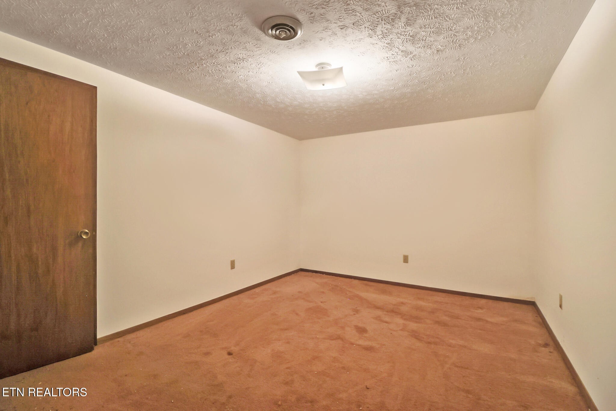 1190 Sand Cut Road Oneida, TN 37841 - Photo 26 of 41 an empty room with a space