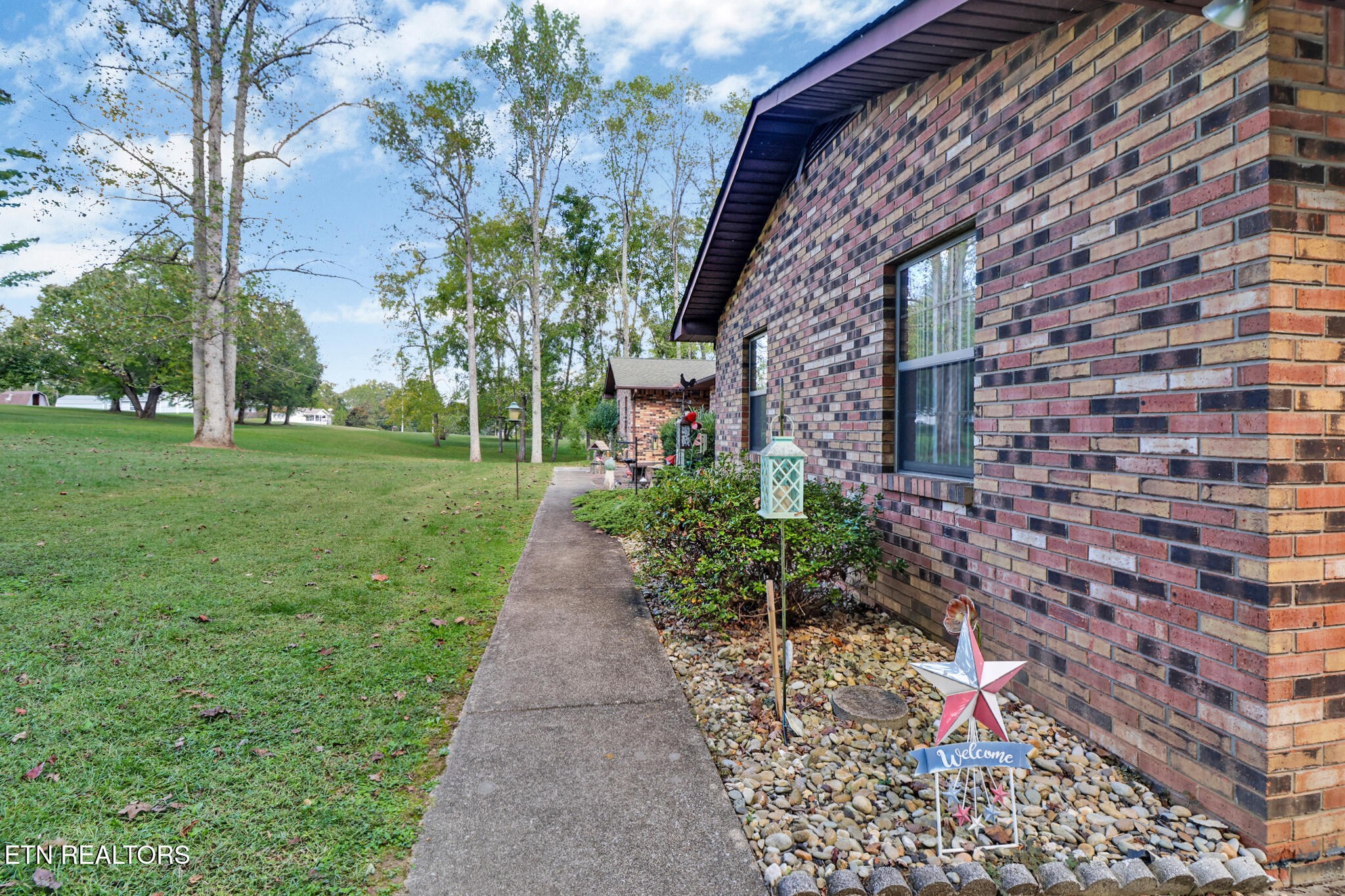 1190 Sand Cut Road Oneida, TN 37841 - Photo 37 of 41 a front view of a house with a yard