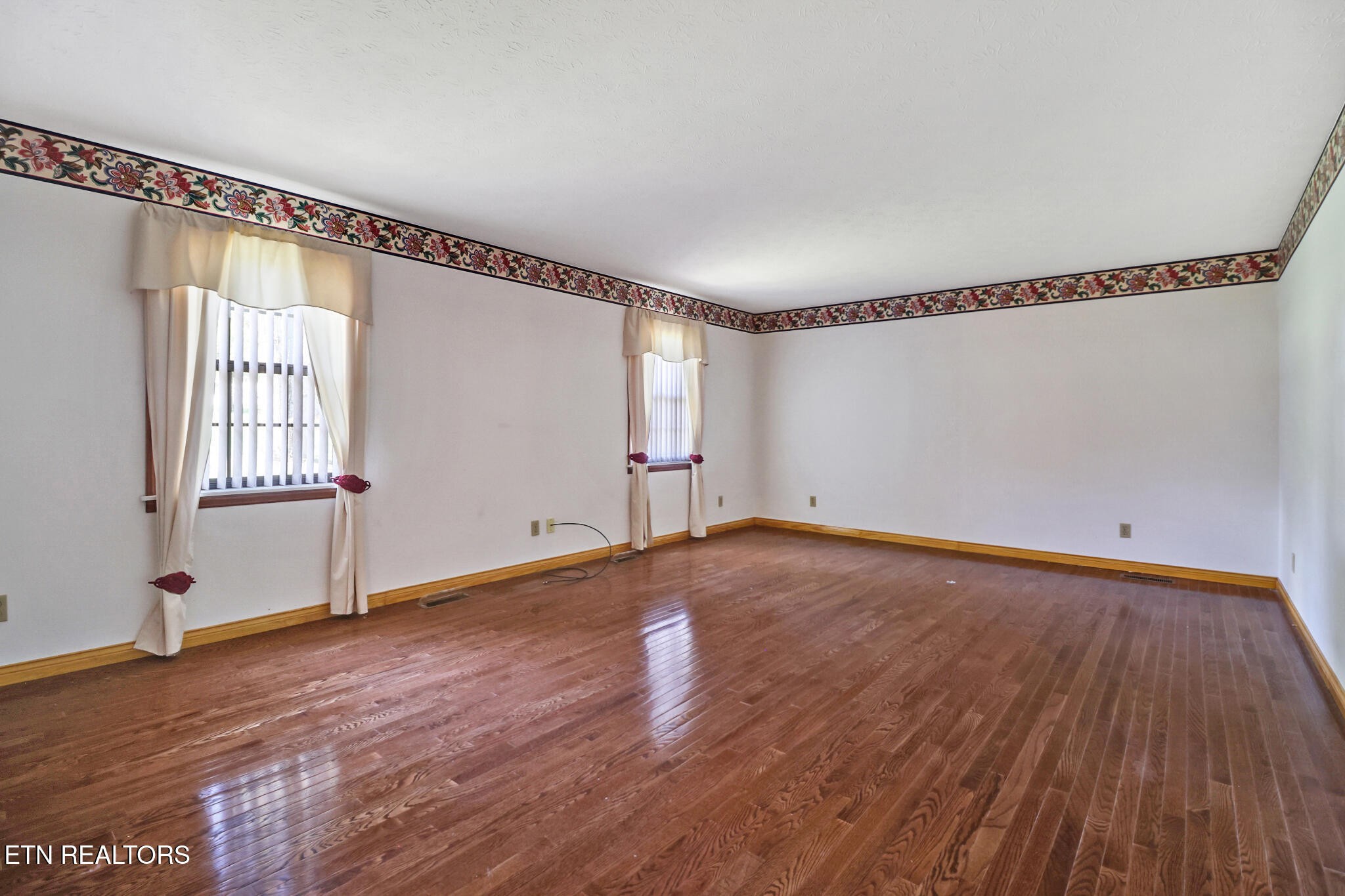1190 Sand Cut Road Oneida, TN 37841 - Photo 9 of 41 a view of empty room with wooden floor and fan