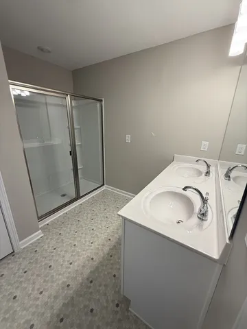 a utility room with a sink washer and dryer