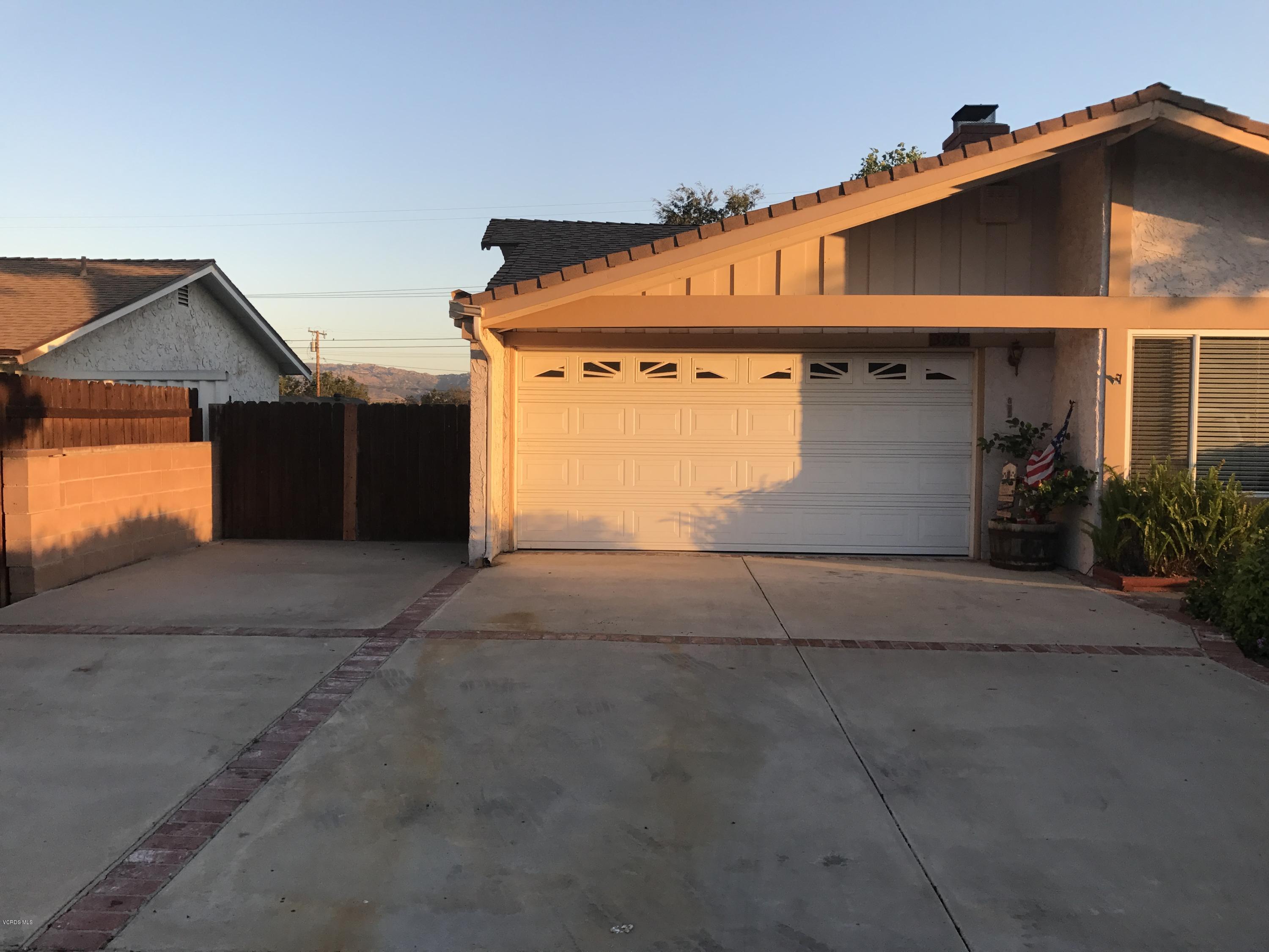 3920 Russ Court Simi Valley, CA 93063 - Photo 2 of 32 a front view of a house with a yard and garage