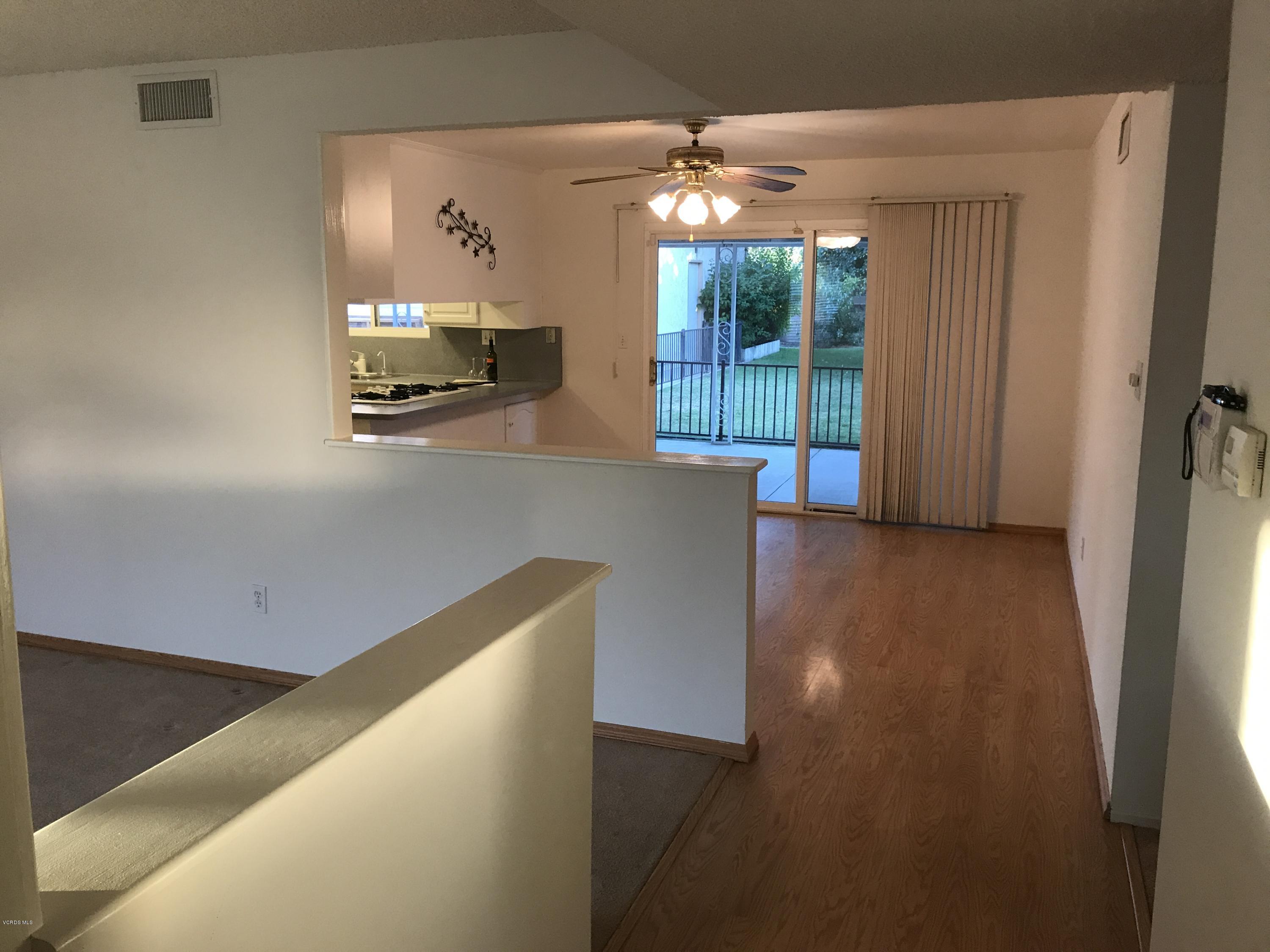 3920 Russ Court Simi Valley, CA 93063 - Photo 11 of 32 a view of a living room with furniture and a large window