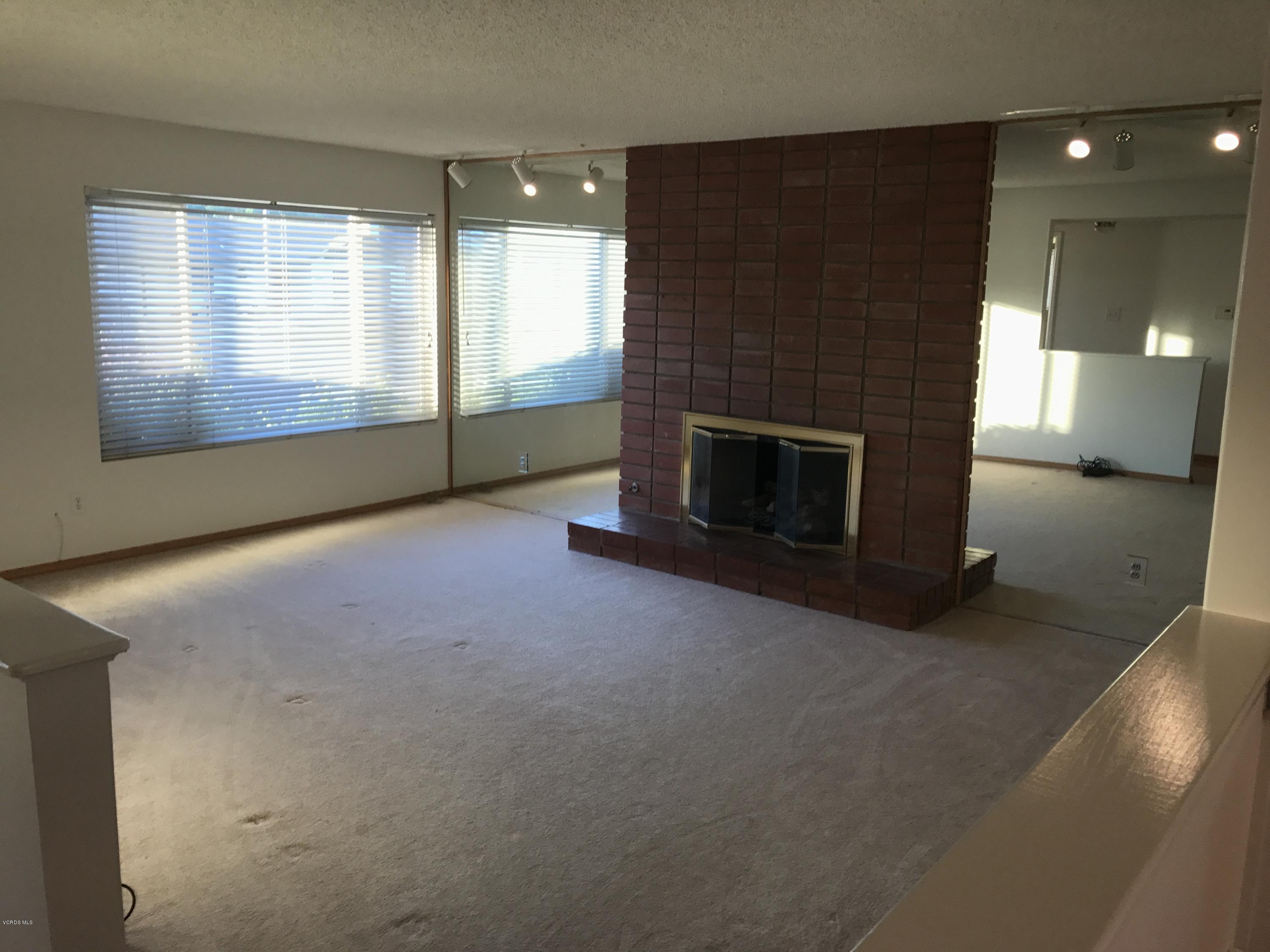 3920 Russ Court Simi Valley, CA 93063 - Photo 13 of 32 an empty room with windows and fireplace