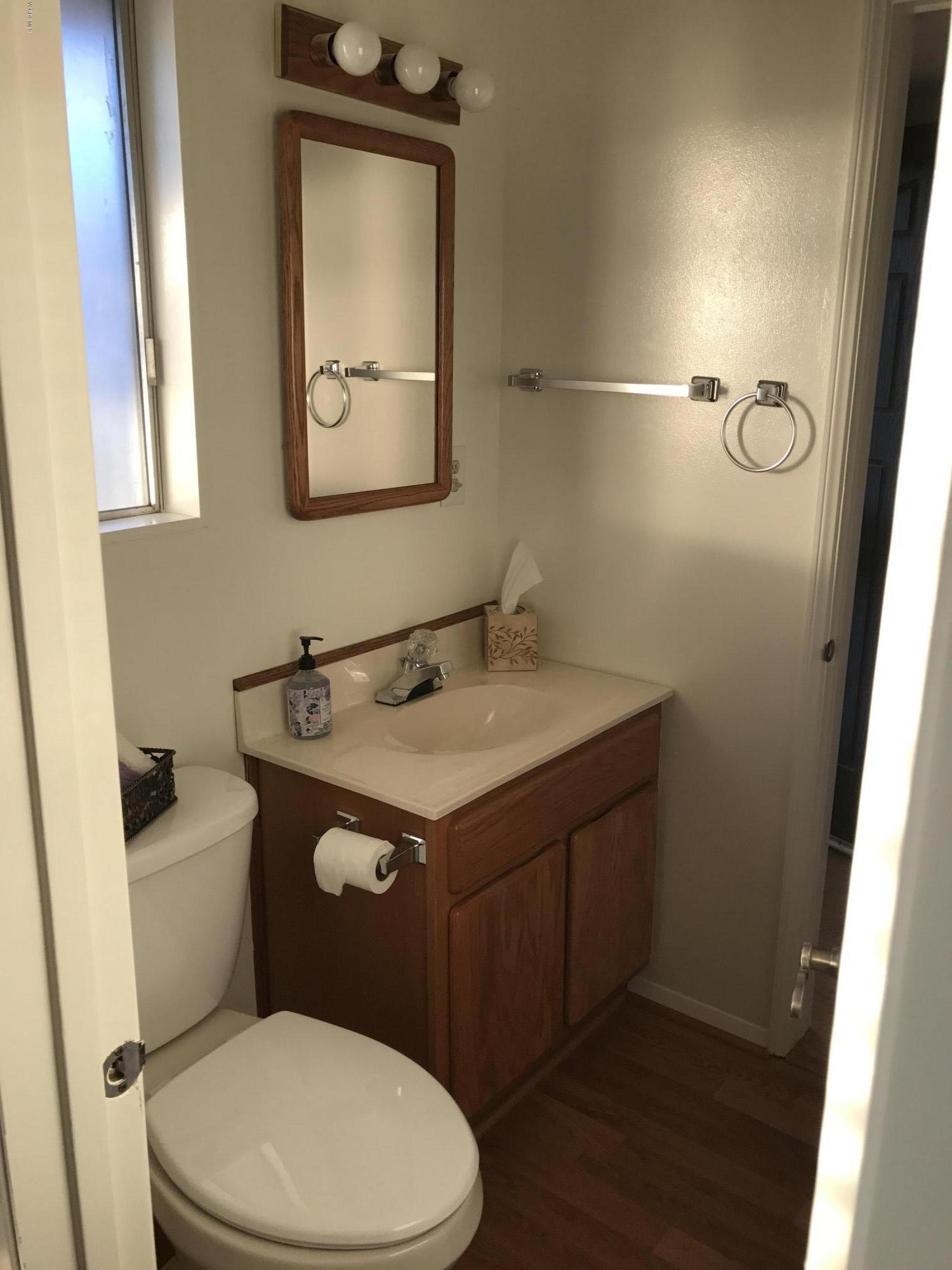 3920 Russ Court Simi Valley, CA 93063 - Photo 20 of 32 a bathroom with a toilet sink and mirror