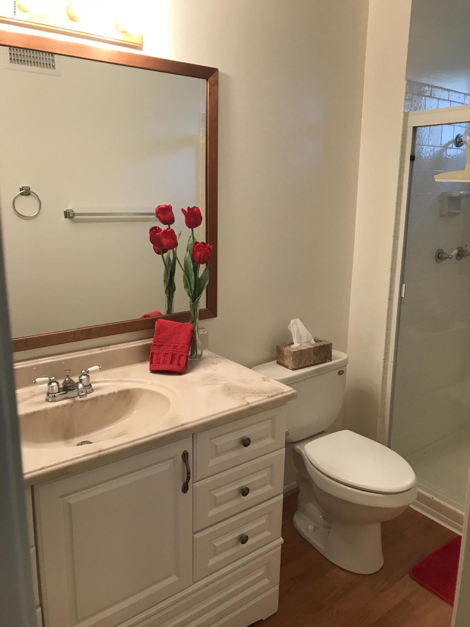 3920 Russ Court Simi Valley, CA 93063 - Photo 21 of 32 a bathroom with a toilet sink vanity granite and shower